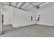 A clean, spacious garage with concrete flooring, white walls, and modern utilities for convenience at 3920 Cedar Knolls Drive Dr # 18, Youngsville, NC 27596