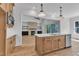 Open-concept kitchen with hardwood floors, an island, and a view of the living room at 3920 Cedar Knolls Drive Dr # 18, Youngsville, NC 27596