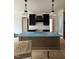 View of the kitchen island with black cabinets and pendant lights above at 3920 Cedar Knolls Drive Dr # 18, Youngsville, NC 27596