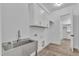 Laundry room featuring sink, cabinets, and access to closet at 3920 Cedar Knolls Drive Dr # 18, Youngsville, NC 27596