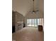 Living room featuring a brick fireplace, built in shelving, and access to the back deck at 3920 Cedar Knolls Drive Dr # 18, Youngsville, NC 27596
