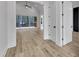 Living room with light hardwood floors and sliding doors to the outdoor area at 3920 Cedar Knolls Drive Dr # 18, Youngsville, NC 27596