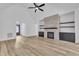 Living room boasts hardwood floors, a fireplace with built-ins, and access to a front door at 3920 Cedar Knolls Drive Dr # 18, Youngsville, NC 27596