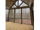 Screened porch showcasing a vaulted ceiling and beautiful views of the wooded backyard at 3920 Cedar Knolls Drive Dr # 18, Youngsville, NC 27596