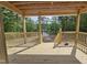 Covered deck overlooking a pond and a wooded lot; home is currently under construction at 42 Ponchartrain St, Fuquay Varina, NC 27526