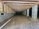 Spacious crawl space under house featuring block supports and wooden beams at 42 Ponchartrain St, Fuquay Varina, NC 27526