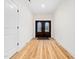 Bright entryway with light wood floors and decorative double doors at 42 Ponchartrain St, Fuquay Varina, NC 27526