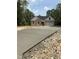 New construction features stone and vinyl siding, a two-car garage and a long concrete driveway at 42 Ponchartrain St, Fuquay Varina, NC 27526