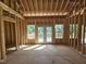 Interior framing of a room with a view to the deck and the wooded backyard at 42 Ponchartrain St, Fuquay Varina, NC 27526