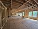 Spacious interior view showcasing the framing of a new home with natural light and an open floor plan at 42 Ponchartrain St, Fuquay Varina, NC 27526