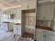 Bright kitchen with shaker cabinets, modern gold hardware, and space for a refrigerator at 42 Ponchartrain St, Fuquay Varina, NC 27526