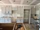 Interior of the kitchen showcasing newly installed, modern cabinetry ready for finishing touches at 42 Ponchartrain St, Fuquay Varina, NC 27526