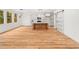 Open concept with kitchen island, white cabinets, and sliding barn door at 42 Ponchartrain St, Fuquay Varina, NC 27526