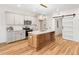 Bright kitchen with a center island, stainless appliances, and a barn door at 42 Ponchartrain St, Fuquay Varina, NC 27526