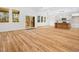 Open living room featuring sliding glass doors to a porch and a kitchen island at 42 Ponchartrain St, Fuquay Varina, NC 27526