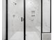 Sleek walk-in shower with white marble tiles and a built-in bench at 42 Ponchartrain St, Fuquay Varina, NC 27526