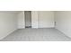This bedroom has neutral colored walls and carpet with an open closet area at 427 Magnolia Run Way, Benson, NC 27504