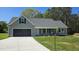 Charming single-Gathering home featuring a two-car garage, well-manicured lawn, and welcoming entrance at 427 Magnolia Run Way, Benson, NC 27504