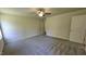 Large main bedroom offers a ceiling fan, neutral decor, and an ensuite bathroom for comfort and privacy at 427 Magnolia Run Way, Benson, NC 27504