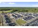 Expansive aerial view of the community, highlighting the layout and surrounding trees at 43 Pansy Park # 233, Clayton, NC 27520