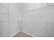 A walk-in closet offers an abundance of shelving for storage and organization at 43 Pansy Park # 233, Clayton, NC 27520
