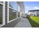 View of exterior vinyl siding of home with sidewalk at 43 Pansy Park # 233, Clayton, NC 27520
