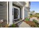 Close-up of a townhome's front entrance, showcasing the door and entryway at 43 Pansy Park # 233, Clayton, NC 27520