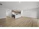 Spacious open-concept living area featuring hardwood floors and abundant natural light at 43 Pansy Park # 233, Clayton, NC 27520