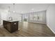 Open floor plan showing kitchen island and living area with sliding glass door at 43 Pansy Park # 233, Clayton, NC 27520