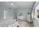 Bright bedroom with nautical themed decor, a ceiling fan, and a view of the exterior landscape at 4318 Peachway Dr, Durham, NC 27705