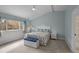 Bedroom with light blue walls, carpet, and a white dresser with nautical themed bedding and decor at 4318 Peachway Dr, Durham, NC 27705