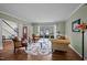 Cozy living room featuring hardwood floors, a large window, and a comfortable seating area at 4318 Peachway Dr, Durham, NC 27705
