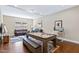 Basement rec room featuring a pool table, desk, and living room setup at 437 Creekhurst Pl, Cary, NC 27519