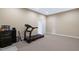Finished basement gym area with a treadmill and entertainment system at 437 Creekhurst Pl, Cary, NC 27519