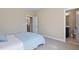 A blue-patterned bedspread is viewed from the doorway of this charming bedroom at 437 Creekhurst Pl, Cary, NC 27519