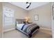 Comfortable bedroom with a ceiling fan, neutral decor, and ample natural light at 437 Creekhurst Pl, Cary, NC 27519