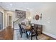 Bright dining area with modern decor, staircase, and patterned rug at 437 Creekhurst Pl, Cary, NC 27519