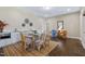 Cozy dining area with a glass table, seating for six, and a kitchenette at 437 Creekhurst Pl, Cary, NC 27519