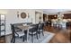 Cozy dining area with banquette seating, stylish decor, and hardwood floors at 437 Creekhurst Pl, Cary, NC 27519
