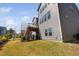 Exterior view showcasing beautiful landscaping and a well-maintained yard near the deck at 437 Creekhurst Pl, Cary, NC 27519