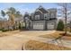 Charming two-story home with a three car garage and beautiful stone accents at 437 Creekhurst Pl, Cary, NC 27519