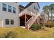 Exterior shot showcasing a multi-story home with a deck overlooking the yard and landscaping at 437 Creekhurst Pl, Cary, NC 27519