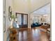 Grand foyer with high ceilings, hardwood floors, and entry to living room at 437 Creekhurst Pl, Cary, NC 27519