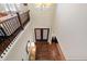 Grand two-story foyer with hardwood floors, staircase, and elegant front entry doors at 437 Creekhurst Pl, Cary, NC 27519