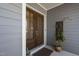 Close-up of the double front doors with sidelights and an exterior plant accent at 437 Creekhurst Pl, Cary, NC 27519