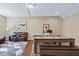 Finished basement game room with a pool table, comfortable seating, and hardwood flooring at 437 Creekhurst Pl, Cary, NC 27519