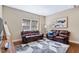 Inviting living room features hardwood floors, natural light, and comfortable seating at 437 Creekhurst Pl, Cary, NC 27519