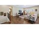 Bright living room with hardwood floors, a fireplace, and large windows at 437 Creekhurst Pl, Cary, NC 27519