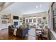 Spacious living room featuring hardwood floors, fireplace, built-in bookshelves, and neutral decor at 437 Creekhurst Pl, Cary, NC 27519