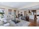 Open-concept living area featuring hardwood floors, neutral walls, and seamless flow to the kitchen at 437 Creekhurst Pl, Cary, NC 27519